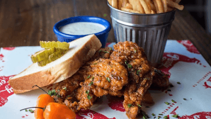 Party Fowl Nashville hot chicken restaurant exterior and signature spicy fried chicken